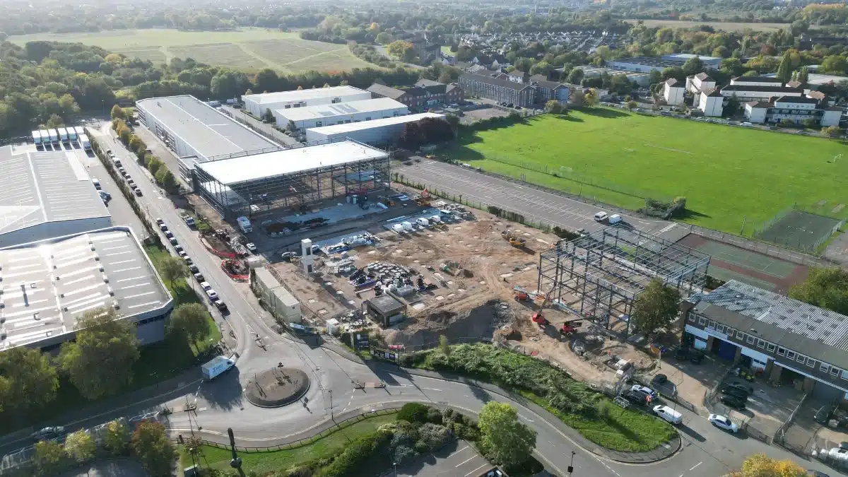 Forest_Road_Steels_Are_Up Aerial view of industrial construction site and buildings.